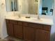Bathroom featuring double sinks, and a glass-enclosed shower, offering a clean and functional space at 6191 S Pearl Dr, Chandler, AZ 85249