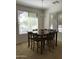 Dining room with a wooden table, seating for six, and bright natural light at 6191 S Pearl Dr, Chandler, AZ 85249