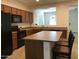 Bright kitchen boasts a breakfast bar, ample counter space, and modern appliances at 6191 S Pearl Dr, Chandler, AZ 85249