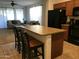 Open kitchen featuring an island with counter seating and modern appliances at 6191 S Pearl Dr, Chandler, AZ 85249