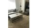 Comfortable living room with a rustic coffee table and cozy seating arrangement at 6191 S Pearl Dr, Chandler, AZ 85249