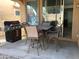 Covered patio includes a grill and patio table set with access to the home's interior at 6191 S Pearl Dr, Chandler, AZ 85249