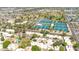 Community aerial view showcasing tennis courts surrounded by residential buildings and lush trees at 6226 N 21St Dr, Phoenix, AZ 85015