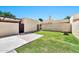 Lovely backyard featuring green grass and a secure gate, offering a secure outdoor retreat at 6226 N 21St Dr, Phoenix, AZ 85015