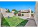 Serene backyard featuring lush green grass and well-maintained landscaping, creating a peaceful outdoor oasis at 6226 N 21St Dr, Phoenix, AZ 85015