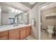 Bathroom with a vanity, neutral walls, framed art, and a well-lit mirror at 6226 N 21St Dr, Phoenix, AZ 85015
