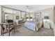Bedroom with large mirrored closet doors and neutral decor, complete with workspace at 6226 N 21St Dr, Phoenix, AZ 85015