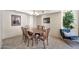 Dining room with an eye catching chandelier and dining table for six at 6226 N 21St Dr, Phoenix, AZ 85015