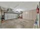 Spacious garage with ample storage cabinets and overhead shelving, offering organized parking at 6226 N 21St Dr, Phoenix, AZ 85015