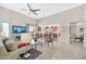 Bright living room with high ceilings, a fireplace, and an open view into the kitchen at 6226 N 21St Dr, Phoenix, AZ 85015