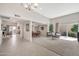 Bright open-concept living room with tile floors, fireplace, and backyard access at 6226 N 21St Dr, Phoenix, AZ 85015