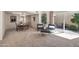 Elegant living space with modern seating, dining table, and sliding doors to the outdoors at 6226 N 21St Dr, Phoenix, AZ 85015