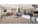 Living and dining area with plush seating, a piano, and ample natural light at 6226 N 21St Dr, Phoenix, AZ 85015