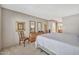 Cozy bedroom featuring neutral walls, comfortable carpeting, and a view of the ensuite bathroom at 6226 N 21St Dr, Phoenix, AZ 85015