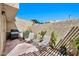Charming patio area with stucco walls, grill, and seating area at 6226 N 21St Dr, Phoenix, AZ 85015
