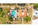 Aerial view of community pool featuring tiled roof, lounge chairs, and lush landscaping at 6226 N 21St Dr, Phoenix, AZ 85015