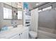 Clean bathroom with a white vanity, mirrored cabinet, and a shower-tub combination at 635 W Gable Ave, Mesa, AZ 85210