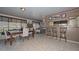 Bright dining room features tile floors, chair railing, and a breakfast bar with seating at 635 W Gable Ave, Mesa, AZ 85210