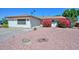 Charming single-story home featuring vibrant pink bougainvillea and a low-maintenance desert landscape at 635 W Gable Ave, Mesa, AZ 85210