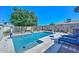 Sparkling pool featuring a sun shelf, basketball hoop, and updated tile. Great for backyard fun and relaxation at 635 W Gable Ave, Mesa, AZ 85210