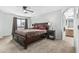 Spacious bedroom with a ceiling fan and large window providing natural light at 6422 W Range Mule Dr, Phoenix, AZ 85083
