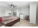Spacious bedroom featuring a ceiling fan and neutral decor at 6422 W Range Mule Dr, Phoenix, AZ 85083