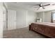 Light-filled bedroom featuring plush carpet and neutral walls and ceiling fan at 6422 W Range Mule Dr, Phoenix, AZ 85083