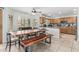 Eat-in kitchen featuring a custom wood table and modern cabinets at 6422 W Range Mule Dr, Phoenix, AZ 85083