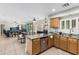 Bright kitchen with stainless appliances that opens to the Gathering room at 6422 W Range Mule Dr, Phoenix, AZ 85083