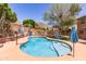 Backyard view of the refreshing pool with lounge area and beautiful mountain views at 6422 W Range Mule Dr, Phoenix, AZ 85083