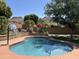 Backyard pool featuring desert landscaping, colorful flowers and mountain views at 6422 W Range Mule Dr, Phoenix, AZ 85083