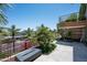 This spacious balcony is surrounded by palm trees, tropical plants and a view of the city skyline at 7167 E Rancho Vista Dr # 4010, Scottsdale, AZ 85251