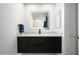 Sleek bathroom featuring a dark wood vanity and illuminated mirror at 7167 E Rancho Vista Dr # 4010, Scottsdale, AZ 85251