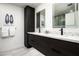Modern bathroom features a dual vanity with dark wood cabinets and quartz countertop at 7167 E Rancho Vista Dr # 4010, Scottsdale, AZ 85251