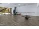 Brightly lit exercise room with hardwood floors, fitness equipment, and floor to ceiling mirror at 7167 E Rancho Vista Dr # 4010, Scottsdale, AZ 85251
