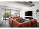 Spacious living room with a comfortable sofa and a wall-mounted TV at 7167 E Rancho Vista Dr # 4010, Scottsdale, AZ 85251