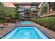 This condo complex features multiple community pools, lounge seating and mature landscaping at 7167 E Rancho Vista Dr # 4010, Scottsdale, AZ 85251
