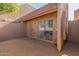 The back patio of this single-story home provides access to the house through a sliding glass door at 7464 N 43Rd Ave, Glendale, AZ 85301