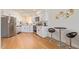 Bright kitchen with white cabinets, modern appliances, and breakfast bar seating at 7464 N 43Rd Ave, Glendale, AZ 85301