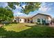 Spacious backyard featuring lush green lawn and partial shade, perfect for outdoor activities at 824 W Mesquite St, Gilbert, AZ 85233