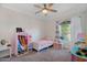 Adorable bedroom featuring carpet, ceiling fan and window at 824 W Mesquite St, Gilbert, AZ 85233