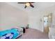 Cozy bedroom with carpet, ceiling fan, and natural light at 824 W Mesquite St, Gilbert, AZ 85233