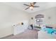 Bright bedroom with ceiling fan and carpeted floors at 824 W Mesquite St, Gilbert, AZ 85233