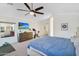 Comfortable bedroom with large TV, workout equipment and natural light at 824 W Mesquite St, Gilbert, AZ 85233