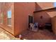 Cozy patio with chairs and sliding glass door access, surrounded by gravel landscaping at 8244 W Albeniz Pl, Phoenix, AZ 85043