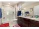 Bathroom featuring a glass-enclosed shower and granite countertops at 8244 W Albeniz Pl, Phoenix, AZ 85043