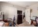 Bedroom with carpet flooring featuring a dresser and doorway to bathroom at 8244 W Albeniz Pl, Phoenix, AZ 85043