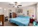 Bedroom with neutral colors, natural light, and a ceiling fan at 8244 W Albeniz Pl, Phoenix, AZ 85043