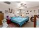 Comfortable bedroom with natural light, a ceiling fan, and neutral decor at 8244 W Albeniz Pl, Phoenix, AZ 85043