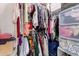 Walk-in closet featuring ample hanging and shelf space at 8244 W Albeniz Pl, Phoenix, AZ 85043
